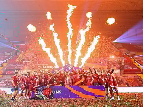 Liverpool celebrate with the Premier League trophy