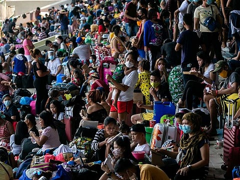 Filipinos stranded due to the coronavirus disease (COVID-19) restrictions cram inside a baseball stadium for a government transportation program that while transport them back to their provinces, in Rizal Memorial Sports Complex, Manila, Philippines, July 25, 2020.