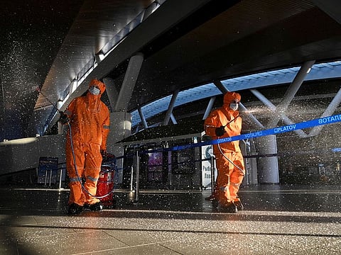 Specialists wearing protective gear spray disinfectant while sanitizing Platov International Airport amid the coronavirus disease (COVID-19) outbreak near Rostov-on-Don, Russia April 15, 2020.