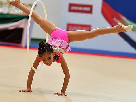 Young Lamia Tariq Malallah Al Farsi performing one of her routines during training.