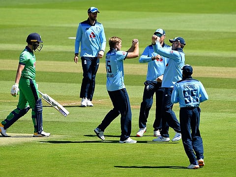England's David Willey, centre, celebrates against Ireland