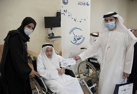 Officials present a gift to a senior Emirati