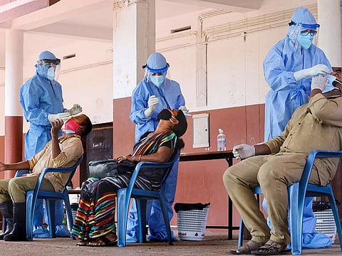 File picture: Health workers collect samples from corporation workers for COVID-19 test, during Unlock 2.0, at a school in Kozhikode, Kerala.