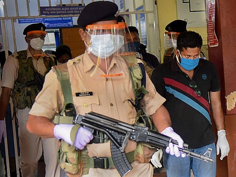 Sandeep Nair (in black), one of the two accused in the Kerala gold smuggling case, arrives for a medical check-up at Ernakulam Government General Hospital, in Kochi, Tuesday, July 28, 2020.
