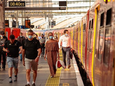 London commuters, wearing protective face masks. As COVID-19 brings the world closer to its worst economic crisis since the Great Depression, workers in the UK may be coming out of the pandemic with considerable savings.