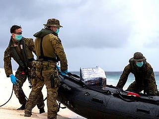 3 men rescued from Pacific island after writing SOS in sand
