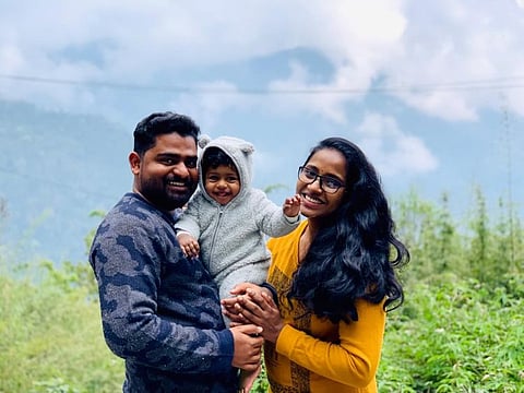Aadarsh P Ratheesh with his wife and daughter