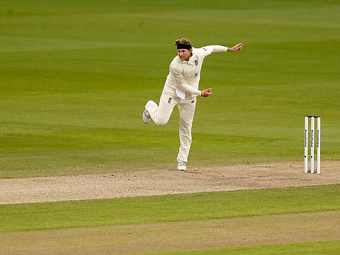 England's captain Joe Root bowls during the first day of the first cricket Test match against Pakistan at Old Trafford in Manchester, on August 5, 2020.