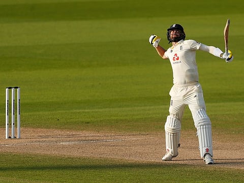 Chris Woakes celebrates as England marched towards victory in the first Test against Pakistan