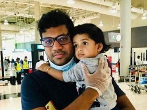 Indian expat Murtaza Faisal holding his daughter Aysha Dua at Dubai International Airport on Friday, August 7 before she boarded the ill-fated flight to Kozhikode.