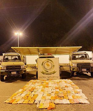 Packets of hashish that Saudi police seized in a fodder cargo.