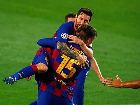 Lionel Messi celebrates his strike against Napoli.