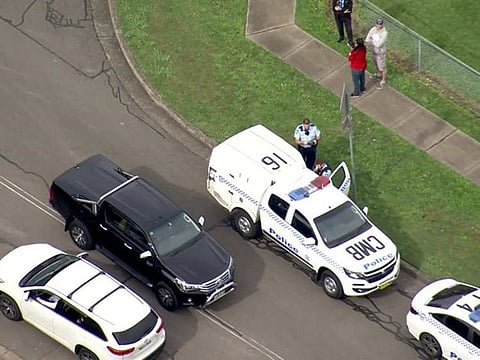 Police at the scene of the stabbing in Sydney on Sunday.