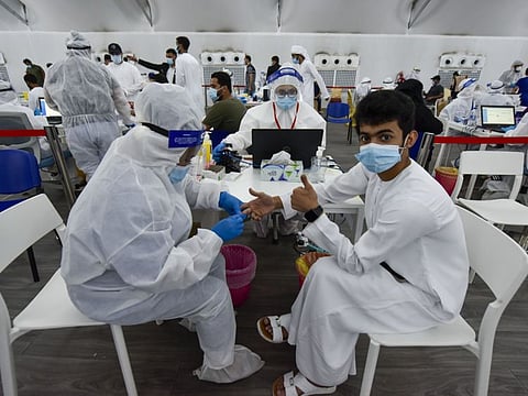 Paramedic staff at screening centre at the Ghantoot Rapid testing facility on Dubai-Abu Dhabi border. The procedure, known as Diffractive Phase Interferometry, or DPI, uses lasers to identify Covid-19 infections in less then 5minutes. 3rd August 2020. Photo: Ahmed Ramzan/ Gulf News