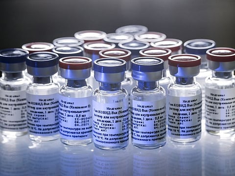 In this handout photo taken on August 6, 2020, and provided by Russian Direct Investment Fund, a new vaccine is on display at the Nikolai Gamaleya National Centre of Epidemiology and Microbiology in Moscow.