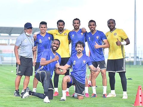 Members of the UAE squad pose alongwith their coach Jorge Luis Pinto in Serbia.