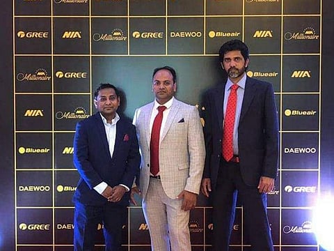 Rahul Sangole (left) with his friends Suhail and Israt, who pooled the money to buy the DDF ticket. Wednesday's DDF raffle was won by Sangole and 10 of his friends.