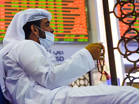 Dubai stocks edged back Sunday with lackluster corporate earnings taking away the risk appetite from investors.