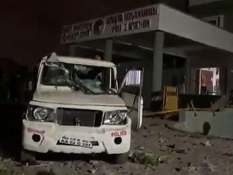 TV channels showed a mob gathered outside a police station and clashing with officers, burning several police vehicles.