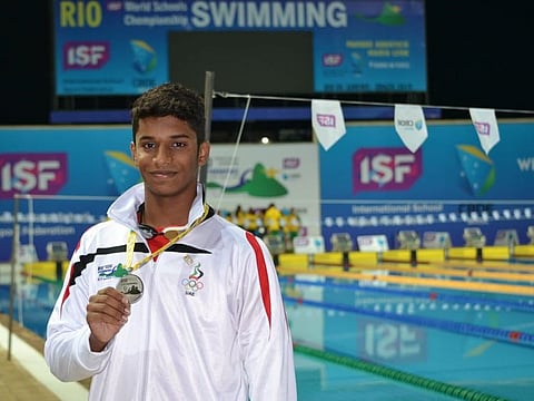 India’s Dubai teen swimmer Tanish George Mathew with his silver medal at the World Schools Championship in Rio 2019.