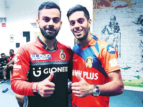 Chirag Suri (right), the only cricketer from UAE so far to have made the cut in IPL for Gujarat Lions, shares a precious moment with Virat Kohli (Royal Challengers Bangalore) during the 2017 season.