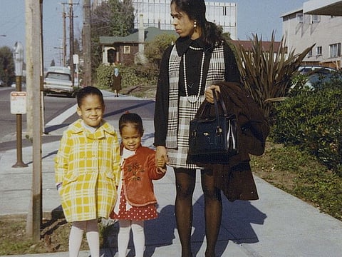 This January 1970 photo provided by the Kamala Harris campaign shows her, left, with her sister, Maya, and mother, Shyamala, outside their apartment in Berkeley, Calif., after her parents' separation.