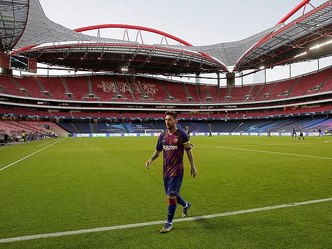 Lionel Messi leaves the field at the Estadio da Luz, Lisbon.