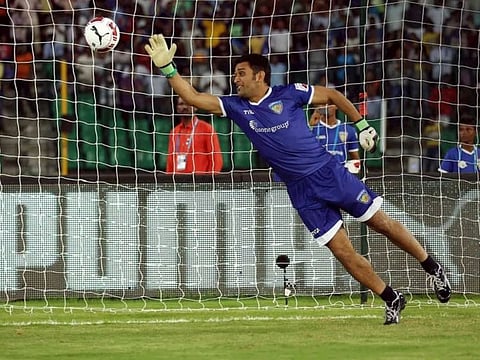 M.S.Dhoni tests his goalkeeping skills during a practice session of Chennaiyin FC , the Chennai-based football team of Indian Super League.