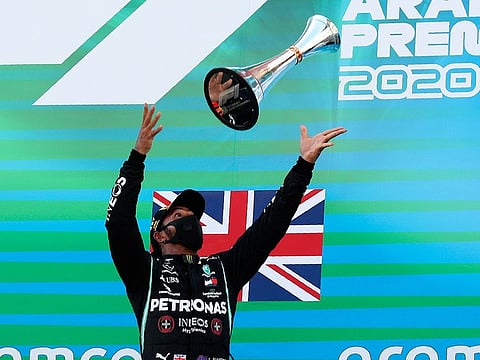 Lewis Hamilton celebrates victory on the Spanish GP podium, his 156th