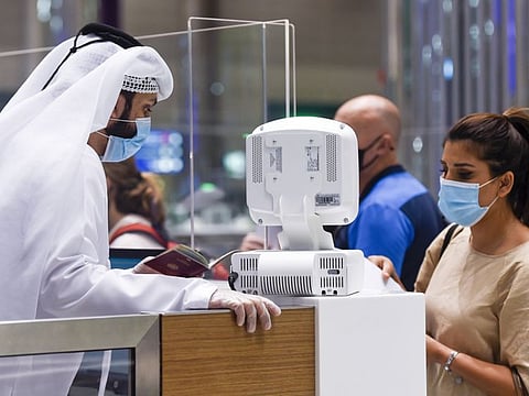Passengers seen arriving at Terminal 3 of Dubai International Airport as Dubai reopened international travel for tourists and residents.