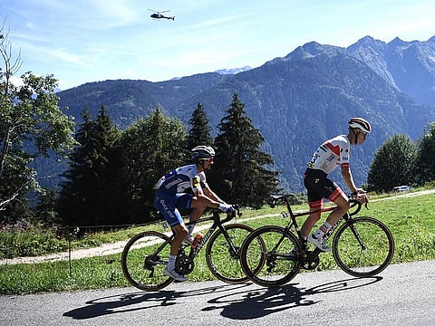 Team Deceuninck riderJulian Alaphilippe and Team UAE Emirates' David De la Cruz climb during the fourth stage of the 72nd edition of the Criterium du Dauphine