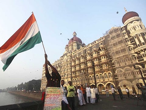 A man waves the Indian tricolour in Mumbai, India
