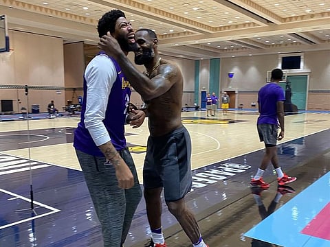Anthony Davies and Lebron James share a joke during LA Lakers training in Orlando