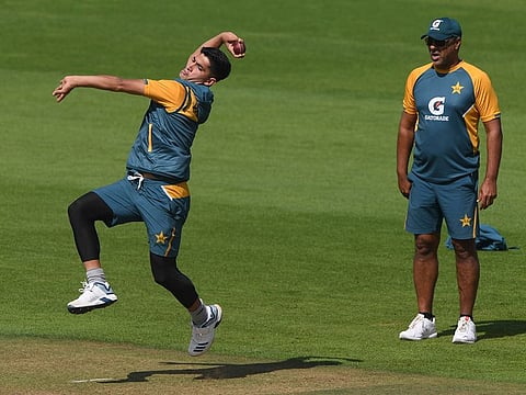 Pakistan's bowling coach Waqar Younis (right) watches Naseem Shah bowl to warm up ahead of the start of play on the fifth day of the second cricket Test match between England and Pakistan, at the Ageas Bowl in Southampton, England, Monday, Aug. 17, 2020.