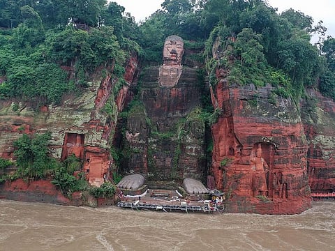 This aerial photo shows the Leshan Giant Buddha surrounded by floodwaters following heavy rains in Leshan in China's southwestern Sichuan province on August 19, 2020.