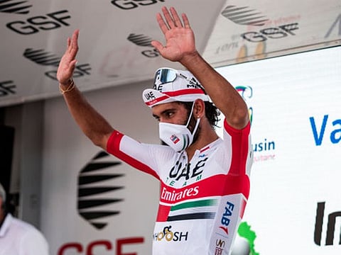 Fernando Gaviria celebrates on the podium