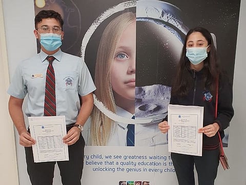 Maryam (head girl and last years winner of Sheikha Fatima award) and Saif (head boy) from GEMS Winchester School Dubai celebrate their GCSE results