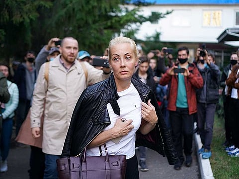 People, including journalists and supporters, surround Yulia Navalnaya, wife of Russian opposition leader Alexei Navalny outside Omsk Emergency Hospital No. 1 where the opposition leader was admitted after he fell ill in what his spokeswoman said was a suspected poisoning, in Omsk on August 21, 2020.
