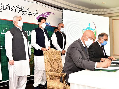 Pakistan Prime Minister Imran Khan at the MoU signing between the Khyber Pakhtunkhwa government and State Life insurance company for universal health coverage in a ceremony in Islamabad.
