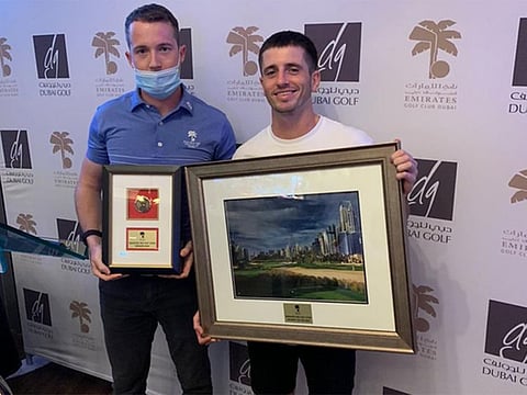 Joe Way (EGC Assistant Golf Services Manager) hands over the winner’s prize to James Yeomans.