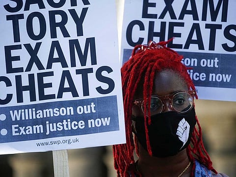 A student attends a protest over the government handling of A-level exam results, outside Downing Street, amid the spread of coronavirus disease (COVID-19), in London on August 21, 2020.
