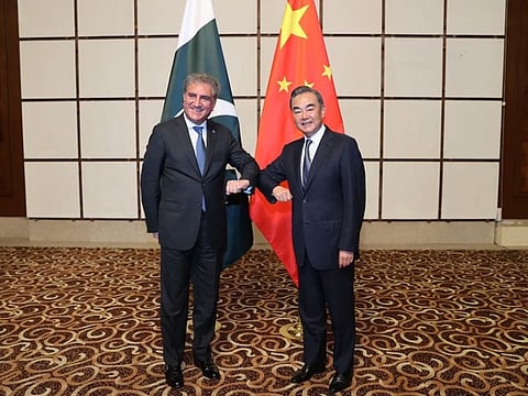 Iron brothers: Pakistan Foreign Minister Shah Mahmood Qureshi and China’s Foreign Minister Wang Yi meet at a strategic dialogue session in the Chinese province of Hainan.