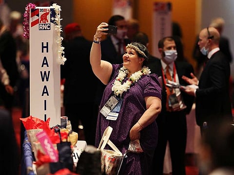 File picture: A delegate takes a photo at the Charlotte Convention Center in Charlotte, N.C. on Monday, Aug. 24, 2020, as delegates gather for the first day of the Republican National Convention.