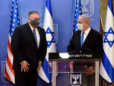 US Secretary of State Mike Pompeo and Israeli Prime Minister Benjamin Netanyahu wear face masks to help prevent the spread of the coronavirus after they make joint statements to the press, in occupied Jerusalem on August 24, 2020.