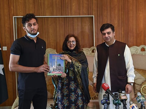 Ammar Ahmed presenting used books to Rana Raheem, former ambassador of Pakistan and Ahmed Amjad Ali, Consul General of Pakistan in Dubai, for the newly established Book Bank at the Pakistan Consulate in Dubai.