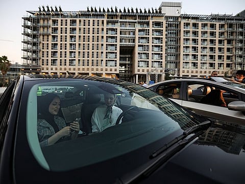 People sit in their cars during the official opening of Amman International Film Festival in the first drive-in cinema, during the coronavirus disease (COVID-19) outbreak, in Amman, Jordan, August 23, 2020.