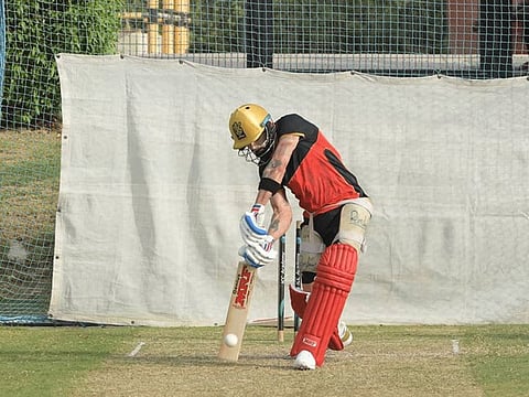 Virat Kohli launches into a trademark cover drive at the nets at ICC Cricket Academy on Friday.