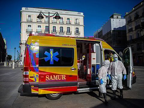 Health workers in personal protection equipments arrive at the Puerta del Sol in Madrid, Spain, on August 28, 2020. A