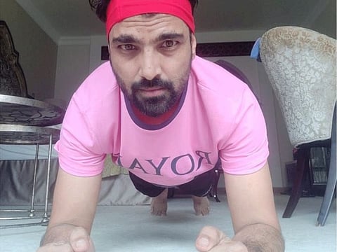 Rajasthan Royals fielding coach Dishant Yagnik keeps himself occupied with freehand exercises during the quarantine period in his Dubai hotel room.