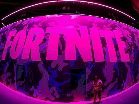 Fortnite is an extremely popular online video game developed by Epic Games and released in 2017. On August 28, 2020, Apple suspended Epic Games's App Store account. It's not immediately clear what will happen next. In general, it is available in three distinct game mode versions that otherwise share the same general gameplay and game engine. FILE PHOTO: An attendee stops to text next to a sign for Epic Games' Fortnite game at E3, the annual video games expo revealing the latest in gaming software and hardware in Los Angeles, California, U.S., June 12, 2019.
